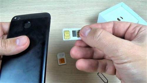 How To Insert A Sim Card And A Flash Drive In Xiaomi Redmi 4